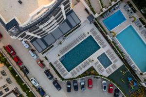 an aerial view of a building with two swimming pools at Aquamarine - Wellness & SPA Hotel in Kranevo