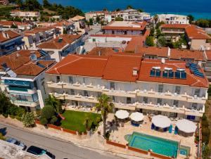 an aerial view of a building with a swimming pool at Melis Studios in Kallithea Halkidikis