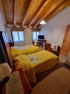 Posteľ alebo postele v izbe v ubytovaní Trattoria Albergo all'Alpino
