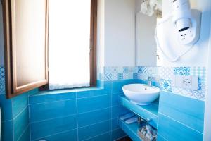 Koupelna v ubytování Agriturismo Il Dolce Vivere