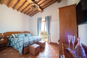 Postel nebo postele na pokoji v ubytování Agriturismo Il Dolce Vivere + 37 fotografií