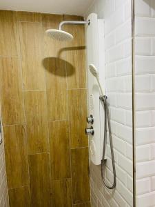 a shower with a glass door in a bathroom at La casita de Lú in Casares +13 photos