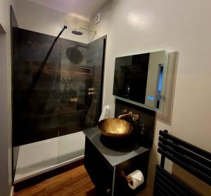 a bathroom with a sink and a shower at Underhill Coach House in Whitby