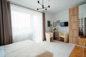 Posteľ alebo postele v izbe v ubytovaní Willa Zaciszne Centrum Augustów