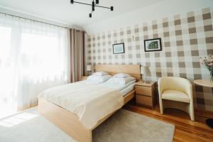 Posteľ alebo postele v izbe v ubytovaní Willa Zaciszne Centrum Augustów