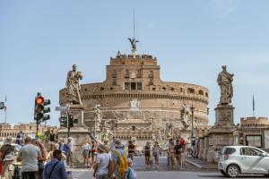 a group of people standing in front of a building at Castel Sant´Angelo Luxury Rooms & Tour in Rome
