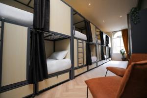a room with four bunk beds in it at Revolver Glasgow in Glasgow