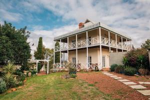 a large house with a balcony on top of it at Hope Farm Guesthouse in York