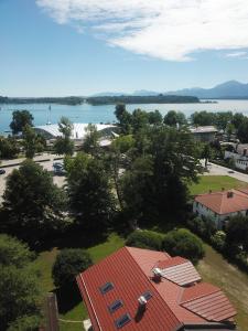 arial view of a building with a view of the water at Chiemseehof in Prien am Chiemsee