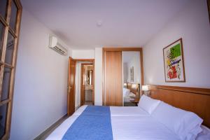 Postel nebo postele na pokoji v ubytování Caybeach Princess