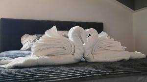 Ένα ή περισσότερα κρεβάτια σε δωμάτιο στο Loft apartman