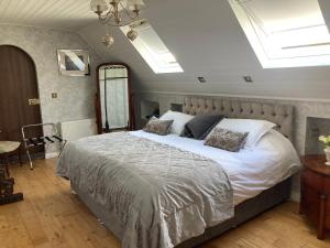 Voodi või voodid majutusasutuse Ivy Cottage B&B toas +20 fotot