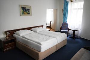 Voodi või voodid majutusasutuse EA Apartmány Mozart toas