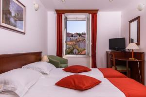 Ein Bett oder Betten in einem Zimmer der Unterkunft Hotel Vila Sikaa
