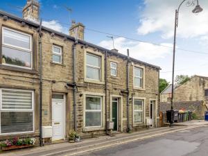 a row of brick houses on a street at Up-Top Cottage in Holmfirth