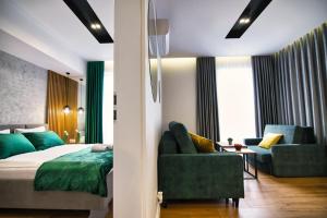 Postel nebo postele na pokoji v ubytování Capital apartaments
