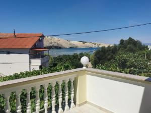 a balcony with a view of the ocean at Apartments Boric in Lopar