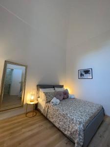 Postel nebo postele na pokoji v ubytování Palazzo Zagarella HOWME