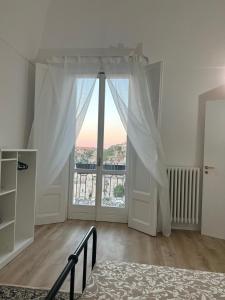Postel nebo postele na pokoji v ubytování Palazzo Zagarella HOWME