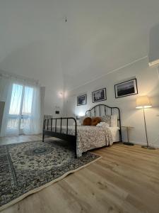 Postel nebo postele na pokoji v ubytování Palazzo Zagarella HOWME