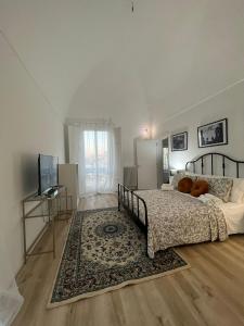Postel nebo postele na pokoji v ubytování Palazzo Zagarella HOWME