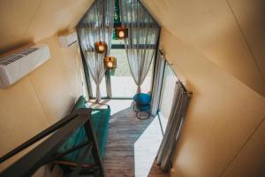a view of a hallway in a tiny house at Goba Sauleskempings in Mērsrags