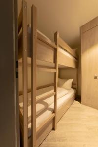 a bedroom with bunk beds in a room at Michels Inselhotel Vier Jahreszeiten in Norderney