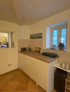 a kitchen with a sink and a counter top at Meraviglia in Vetralla +13 photos