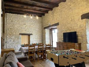 a living room with a table and a chess board at Palacio de Aralar in Oskotz