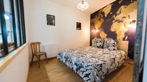 Łóżko lub łóżka w pokoju w obiekcie L'Atelier Flanelle