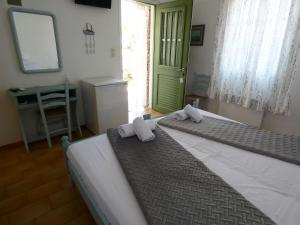 Postel nebo postele na pokoji v ubytování Το Κατἑ