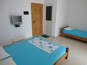 Postel nebo postele na pokoji v ubytování Spiro Guest House