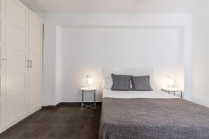 Posteľ alebo postele v izbe v ubytovaní FUN BUILDING FLATS by HOMEABOUT