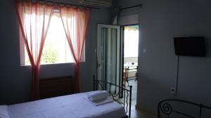 Postel nebo postele na pokoji v ubytování EOΣ