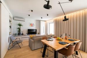 a living room with a table and a couch at Sea View apartment Maja in Bol