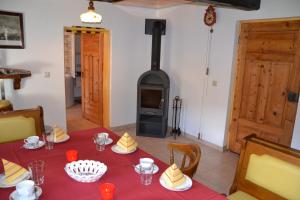 a dining room with a table and a wood stove at Ferienhaus Häuslbauer in Schladming