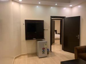 Телевізор і / або розважальний центр в Ghadeen Furnished Apartments