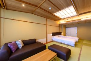 Uma cama ou camas num quarto em Oishiya
