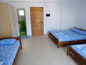 Postel nebo postele na pokoji v ubytování Spiro Guest House