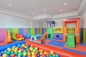 a play room with a bunch of toys and balls at BelAire Bangkok Sukhumvit - SHA Extra Plus in Bangkok