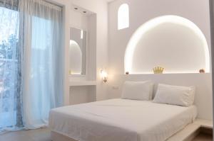 Säng eller sängar i ett rum på Villa Iliousa Princess