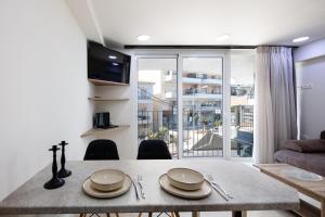Televízia a/alebo spoločenská miestnosť v ubytovaní Sun Moon Apartments