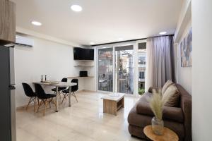Televízia a/alebo spoločenská miestnosť v ubytovaní Sun Moon Apartments