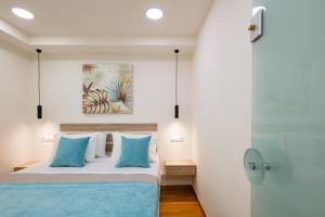 Posteľ alebo postele v izbe v ubytovaní Sun Moon Apartments