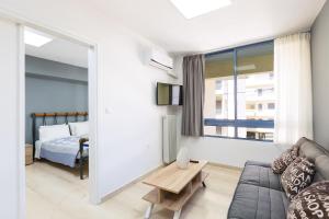 Posteľ alebo postele v izbe v ubytovaní Sun Moon Apartments
