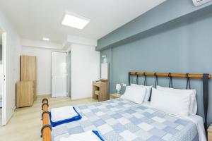 Posteľ alebo postele v izbe v ubytovaní Sun Moon Apartments