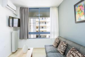 Televízia a/alebo spoločenská miestnosť v ubytovaní Sun Moon Apartments