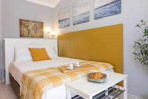 Posteľ alebo postele v izbe v ubytovaní Malaga Center Flat - SoHo Center Apartments