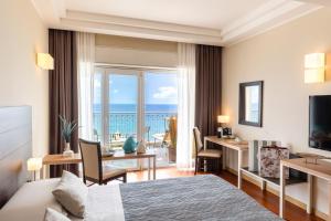Телевизор и/или развлекательный центр в Grand Hotel Spiaggia