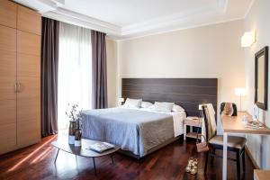 Кровать или кровати в номере Grand Hotel Spiaggia